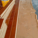 Γραφεία ναυτιλιακής εταιρείας στο Ελληνικό. Κολλητή τοποθέτηση προγυαλισμένου δαπέδου πάνω σε τσιμεντοκονία με ενδοδαπέδια θέρμανση.